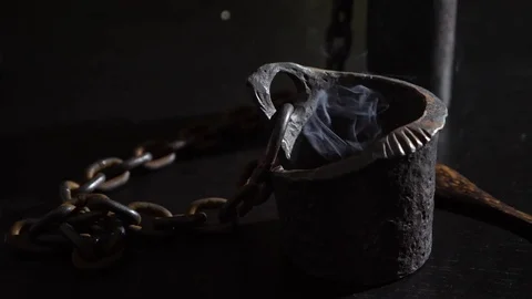 Iron candlestick with chains with candles close-up. A magical ritual. Divination Stock Footage 78157589