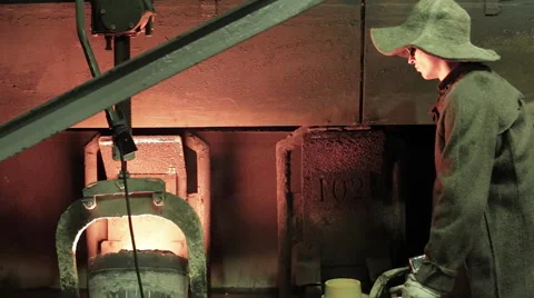 Iron casting with heated container and professional worker Stock Footage 62083459