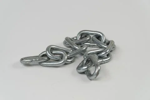 Iron chain on platform with isolated on white background Stock-Fotos