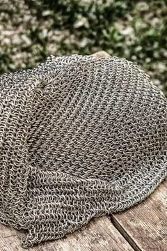 Iron chainmail pattern heaped, protective clothing for a medieval warrior Stock Photos