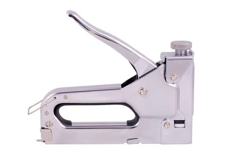 Iron construction stapler on a white background. Isolated image Stock Photos