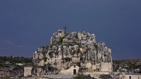 Iron cross on a large rock with lightning and storm in the background. Version 2 Stock Footage 280615091