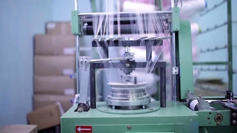 Iron cylinder weaves the fabric threads. Stock Footage