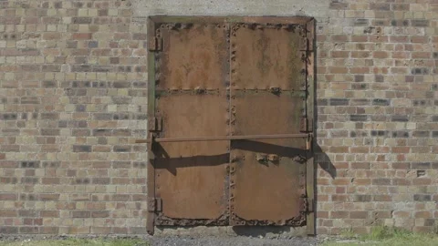 Iron door in a brick wall Stock Footage 159474799