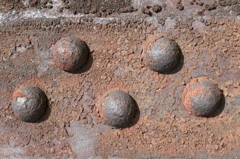 Iron element with old rivets Stock Photos
