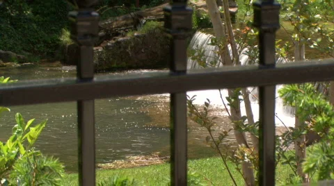 iron fence waterfall Stock Footage