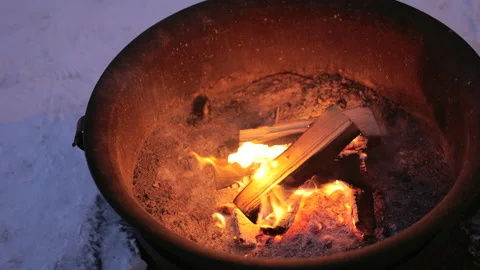 Iron fire pit and burning fire outdoors Stock Footage 251528283