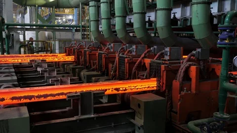 Iron foundry. Continuous casting machine. The workpiece moves along the conveyor Stock Footage 122494069