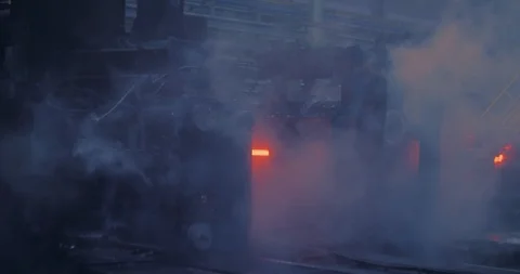 Iron foundry. Continuous casting machine. Steel billet moving through the Stock Footage 124713289
