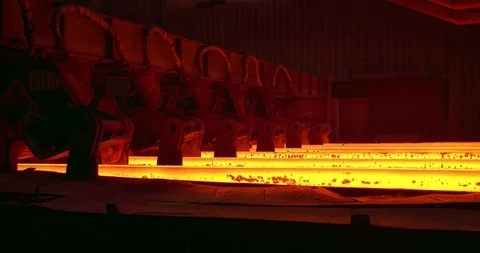 Iron foundry. Continuous casting machine. Steel billet moving through the Stock Footage 124714110
