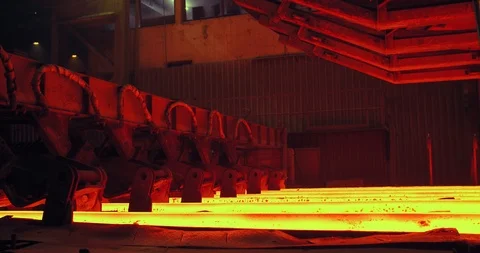 Iron foundry. Continuous casting machine. Steel billet moving through the Stock Footage 125109222