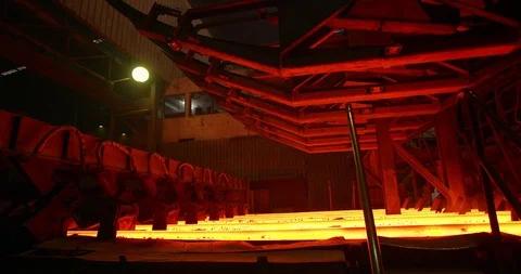 Iron foundry. Continuous casting machine. Steel billet moving through the Stock Footage 125305186
