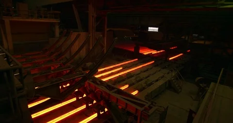Iron foundry. Continuous casting machine. Steel billet moving through the Stock Footage 125306042
