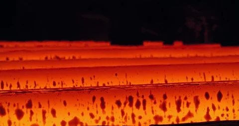Iron foundry. Continuous casting machine. Steel billet moving through the Stock Footage 125307913