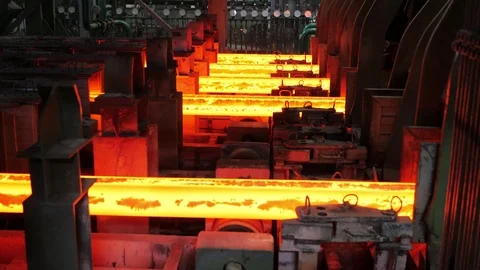 Iron foundry.Continuous casting machine.Steel billet moving through the pipeline Stock Footage 122493629