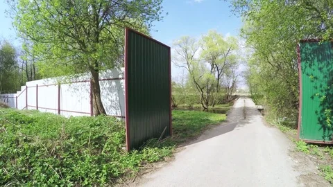 Iron gate and concrete path Stock Footage
