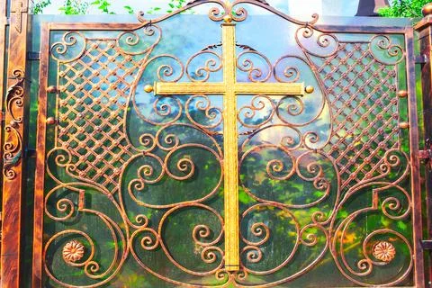 Iron gate with cross Fotos de archivo