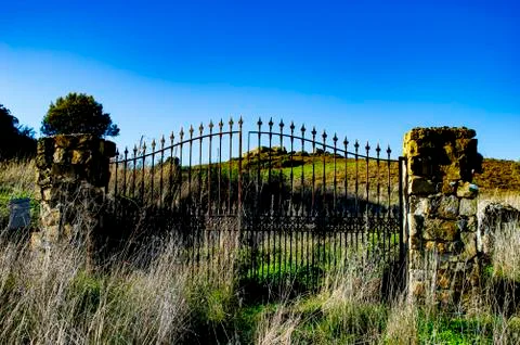 Iron gate in the middle of the hill Stock Photos