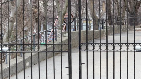 Iron gates are opening, access to an apartment building courtyard 動画素材 170771050