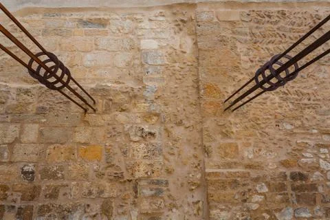 Iron hammered in the wall Stock Photos