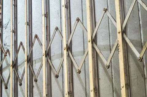 An iron harmonica door or rolling door or folding door Stock Photos