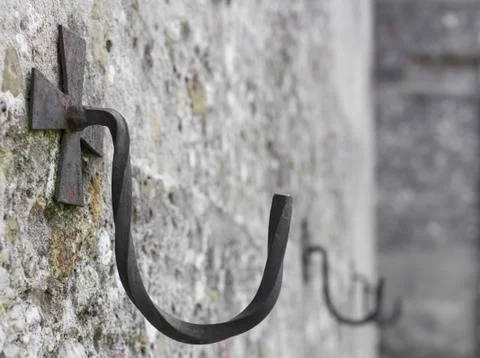 Iron hook on wall Stock Photos
