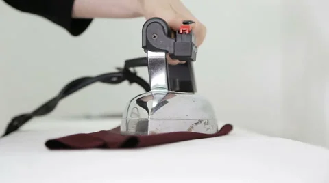 Iron. ironing board. a worker's hands at a textile factory. Stock Footage 60761905