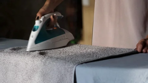 Iron ironing towel Stock Footage 102854070