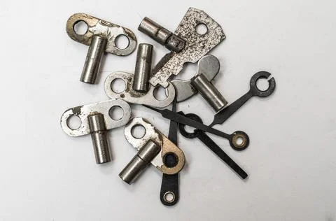 Iron keys to the clockwork hours Stock Photos
