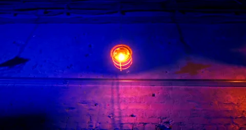 Iron lantern on a long chain swinging in different directions. Neon lighting Stock Footage 171851253