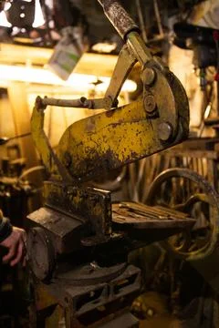 Iron mechanical machine yellow in the workshop Stock Photos