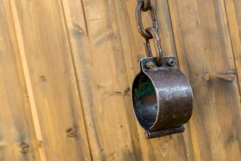 Iron old chains with a chain of chained slaves and criminals mediaeval Stock Photos