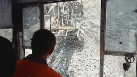 Iron ore loading view from the cab of the excavator driver Stock Footage 116774991