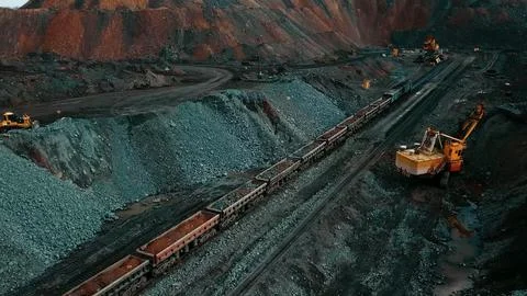 Iron ore quarry loading and transportation, aerial view Fotos de archivo