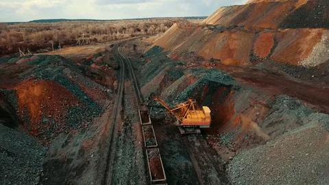 Iron ore quarry loading and transportation, aerial view Fotos de archivo