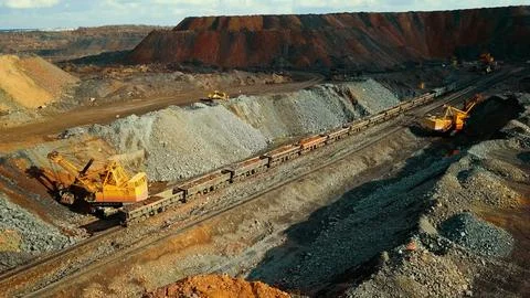 Iron ore quarry loading and transportation, aerial view Fotos de archivo