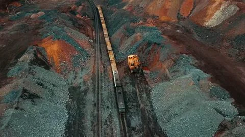 Iron ore quarry loading and transportation, aerial view Fotos de archivo