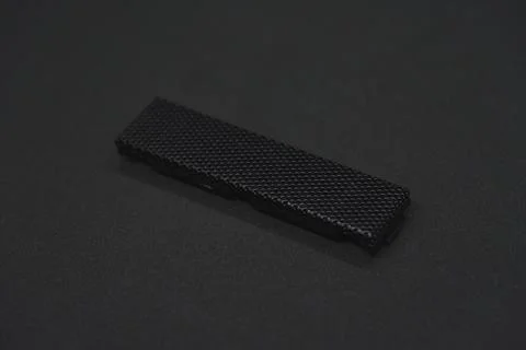 The iron panel from the computer. Iron black mesh panel. Metal rectangular .. Stock Photos