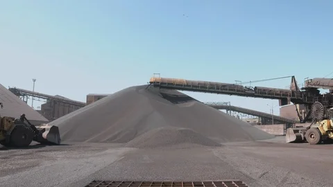 Iron pellets transshipment in dock Stock Footage 90898668