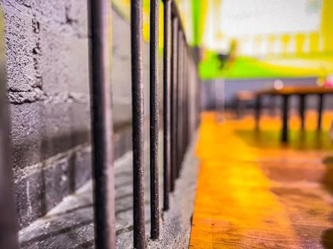 Iron pillar at the edge of the cafe Stock Photos
