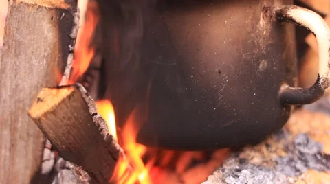 Iron pot on burning campfire Stock Footage 65820070