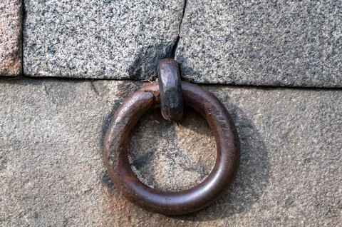 Iron ring in a granite wall. Stock Photos