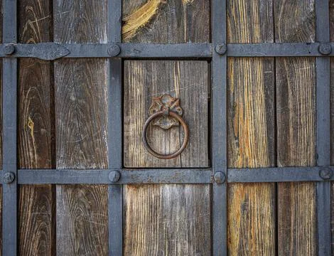 Iron ring on an old door Stock Photos