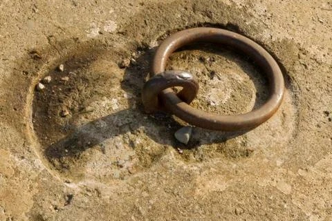 Iron ring set in concrete Stock Photos