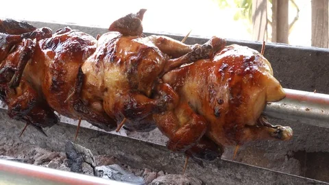 Iron roasted chicken on charcoal grill Stock Footage