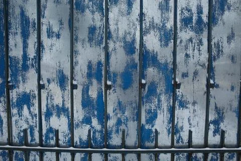 Iron, rusty texture. An old piece of iron, stained paint on the wall. Stock Photos