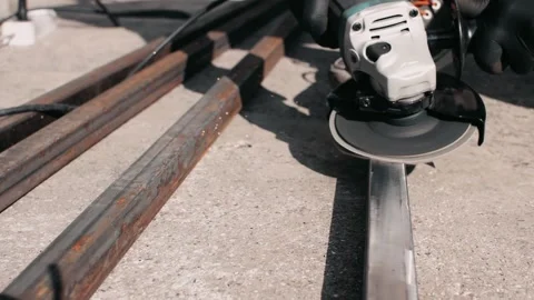 Iron scale dries off while worker clearing rust Stock Footage 139895985