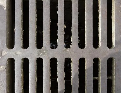 Iron sewer grating. Stock Photos