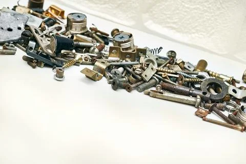 Iron small metal trash. Lots of different nuts, bolts, washers Stock Photos