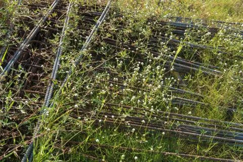 Iron stack on the grass. Stock Photos